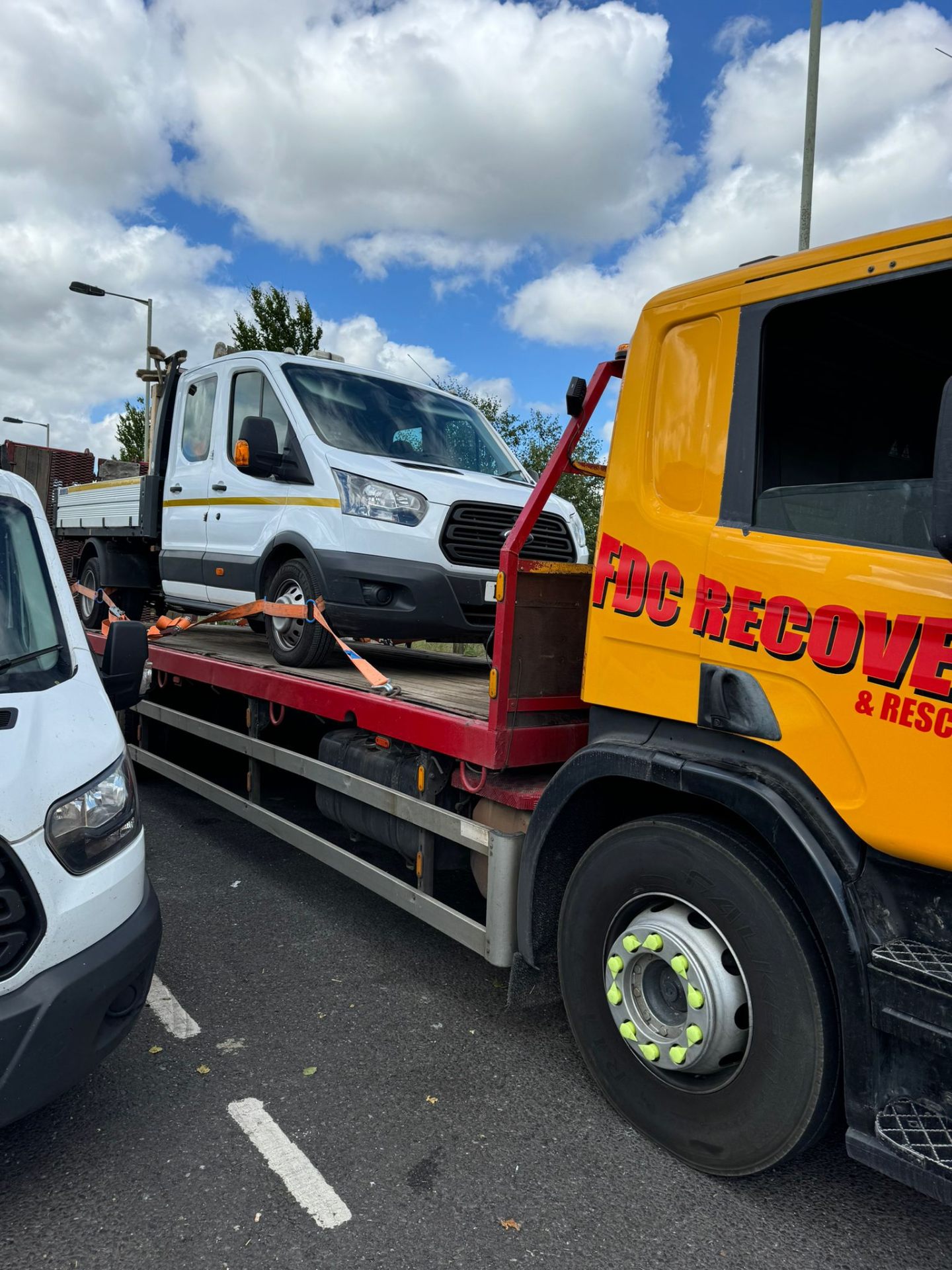 FDC Recovery truck loaded with a Ford Transit tipper