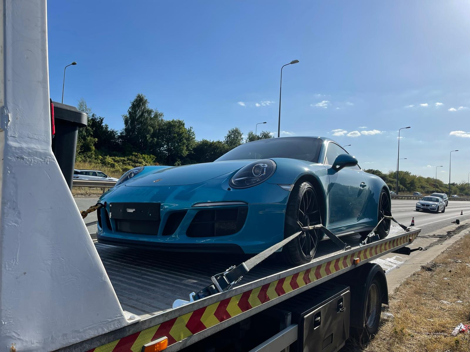 Porsche 911 GTS loaded onto FDC low-loader on the motorway