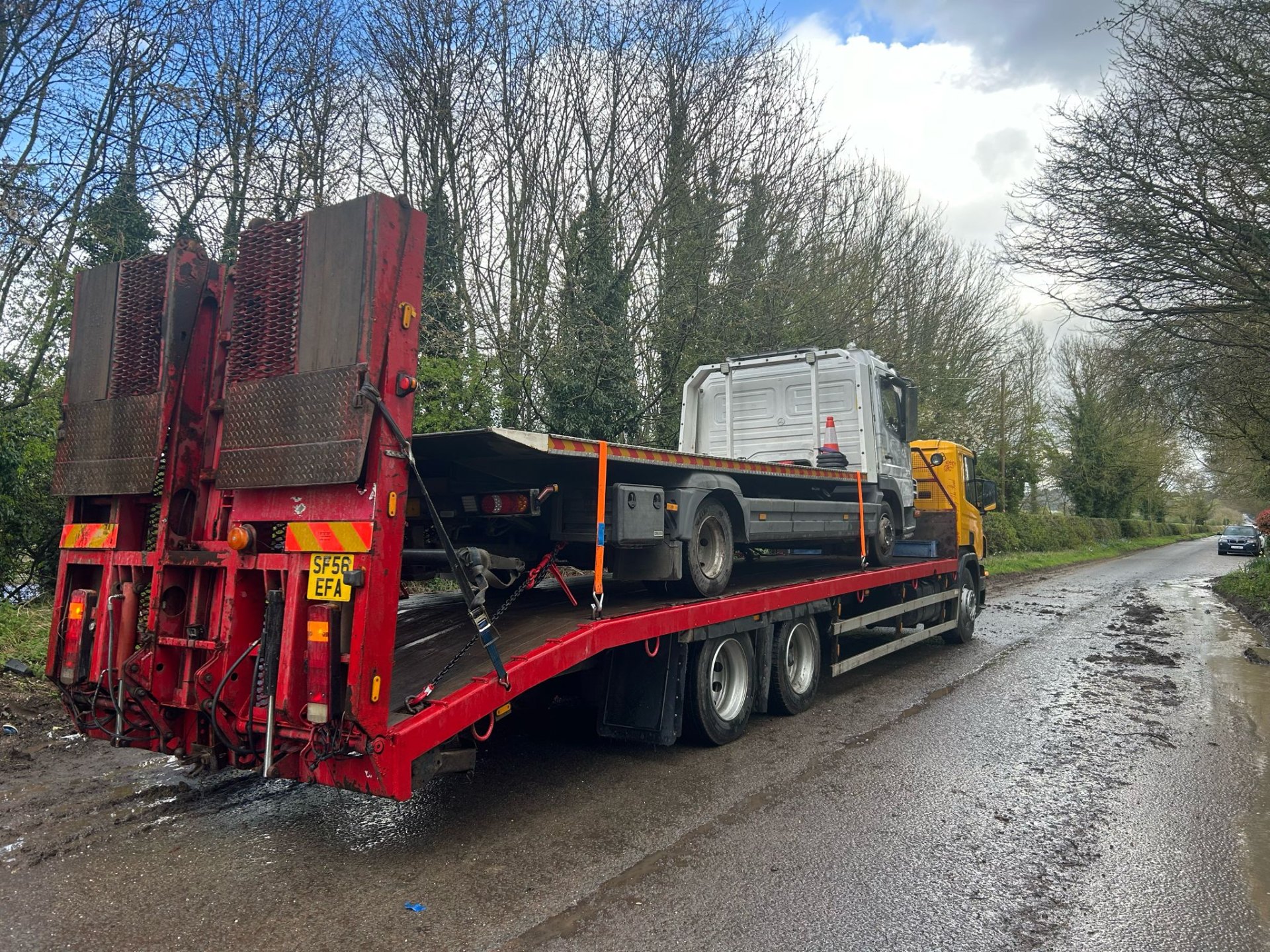 FDC recovery truck with lowered ramps on a country road