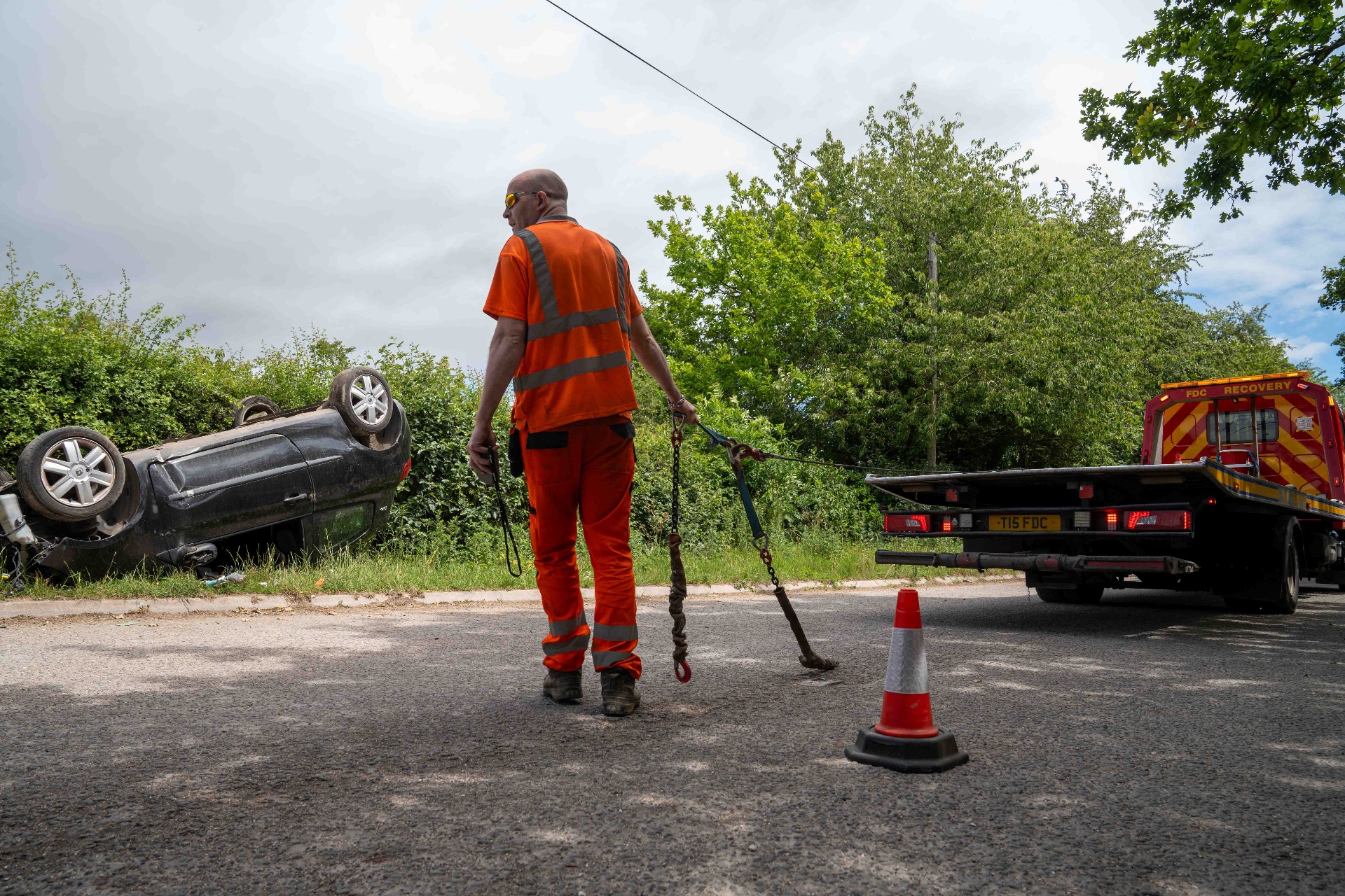 FDC crew member preparing to recover an overturned car